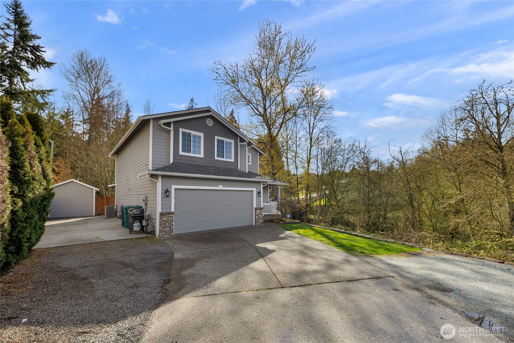 11628 50th Drive Southeast Everett, WA 98208 - Photo 26 of 37 a front view of a house with a yard and garage
