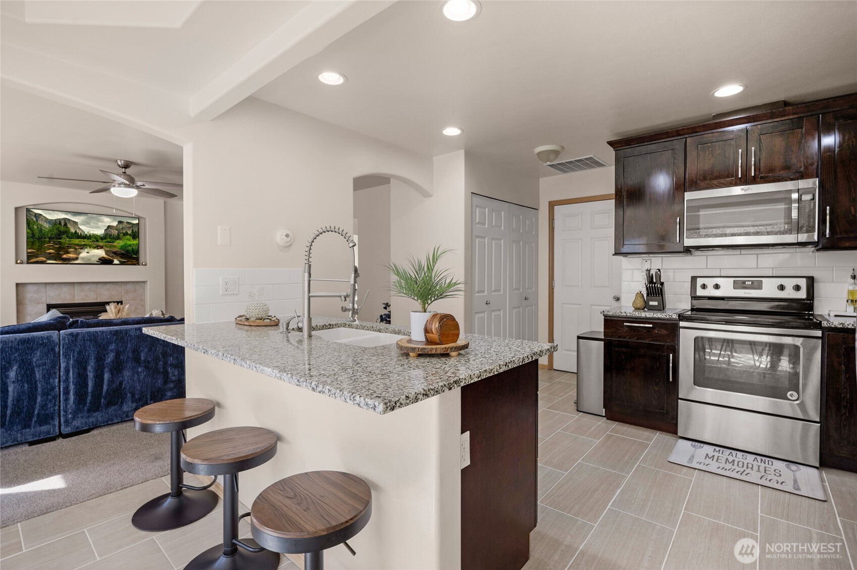 11628 50th Drive Southeast Everett, WA 98208 - Photo 3 of 37 a kitchen with stainless steel appliances granite countertop a sink and stove