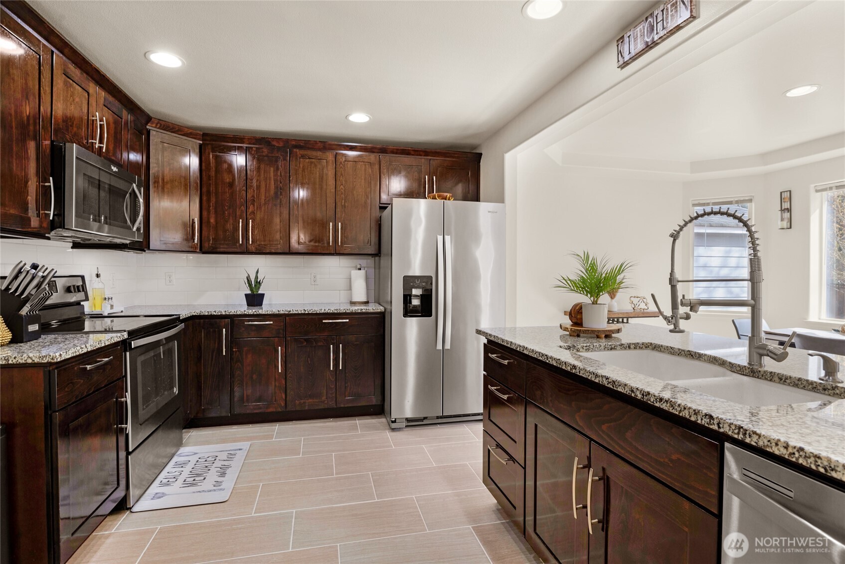 11628 50th Drive Southeast Everett, WA 98208 - Photo 6 of 37 a kitchen with a sink stove and refrigerator