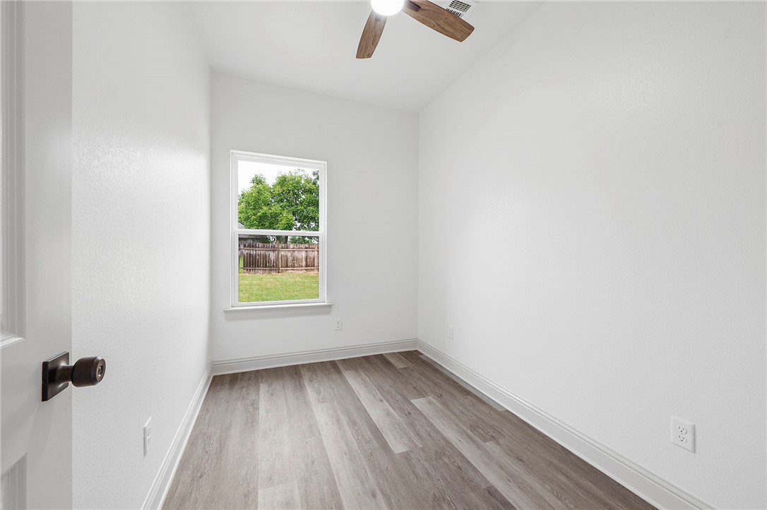 505 Legion Court Bryan, TX 77803 - Photo 14 of 21 a view of room with window and hardwood floor