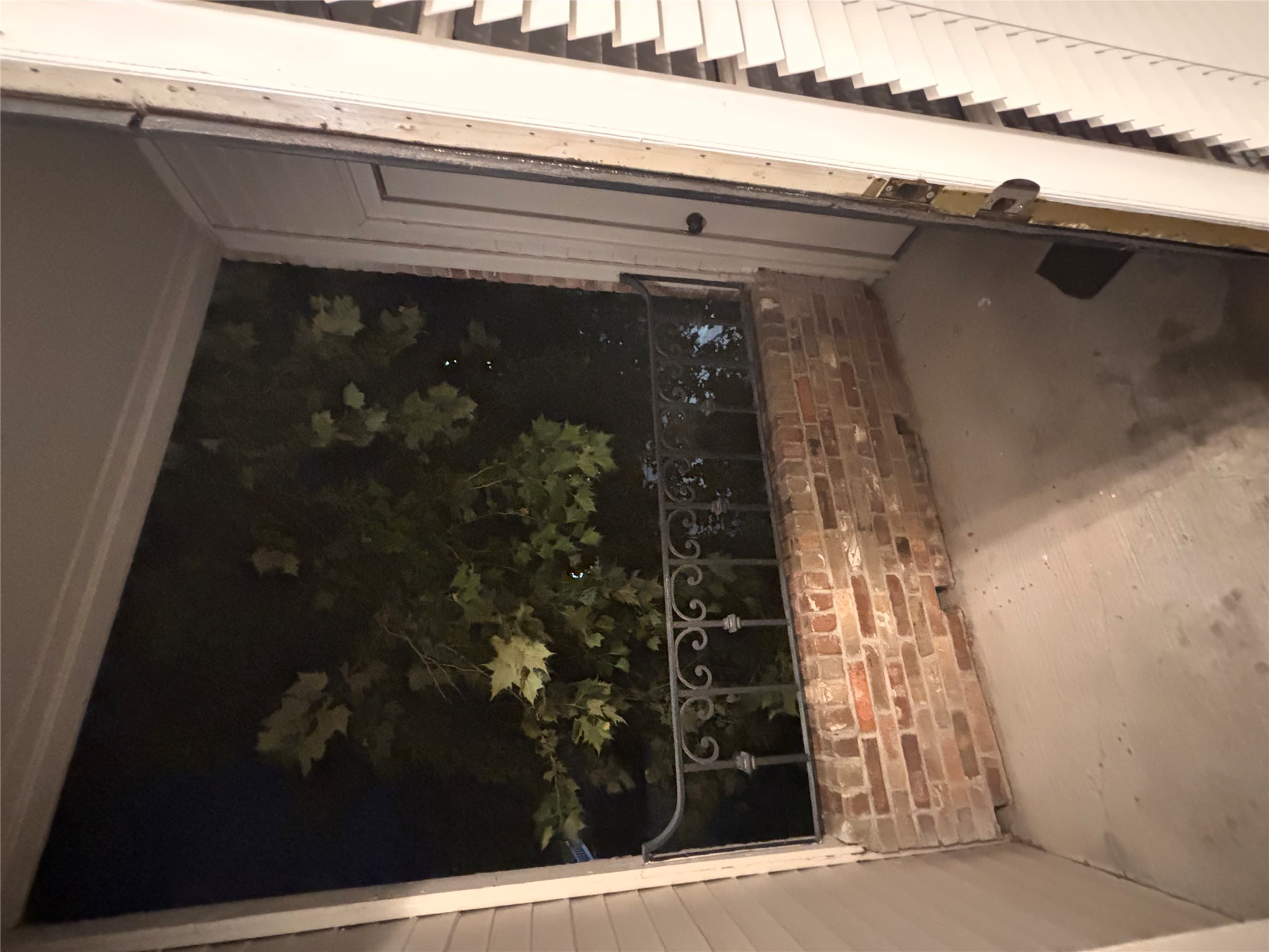 2801 Rio Grande Street, Unit 208 Austin, TX 78705 - Photo 25 of 25 A quaint private balcony with brick and wrought iron railings offers an intimate outdoor escape.