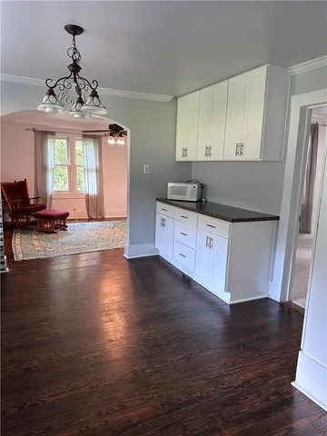 a kitchen with granite countertop a stove and a refrigerator