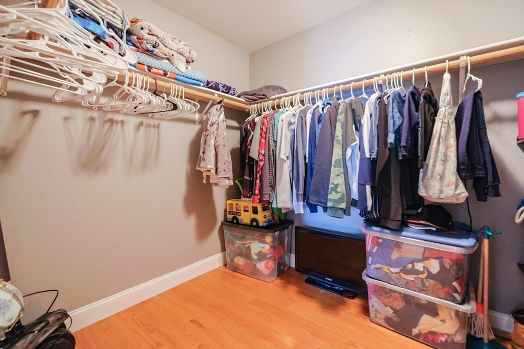 8 A Whitins Road Sutton, MA 01590 - Photo 15 of 26 a view of walk in closet with clothes and shoes