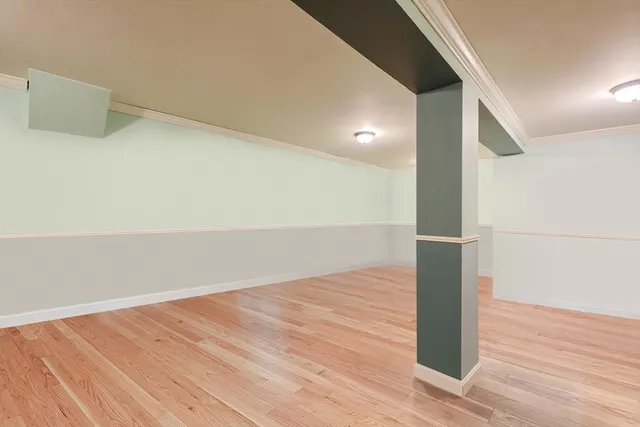 an empty room with wooden floor