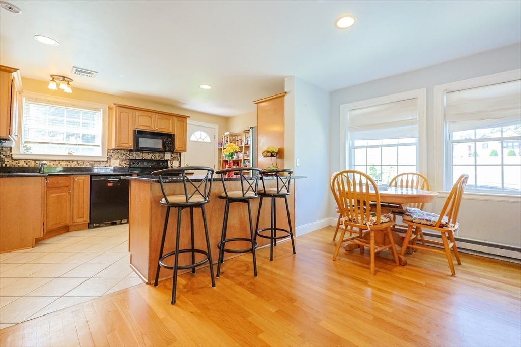 8 A Whitins Road Sutton, MA 01590 - Photo 2 of 26 a view of a dining room with furniture and wooden floor