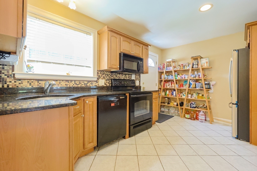 8 A Whitins Road Sutton, MA 01590 - Photo 3 of 26 a kitchen with stainless steel appliances a stove sink and microwave