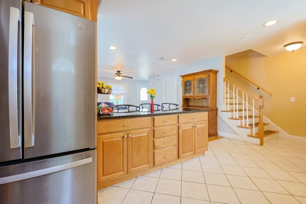 8 A Whitins Road Sutton, MA 01590 - Photo 5 of 26 a kitchen with stainless steel appliances granite countertop a refrigerator and a stove