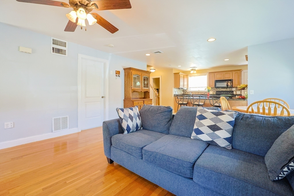 8 A Whitins Road Sutton, MA 01590 - Photo 8 of 26 a living room with furniture and kitchen view