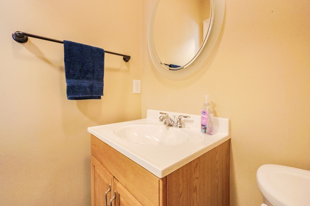 8 A Whitins Road Sutton, MA 01590 - Photo 9 of 26 a bathroom with a sink vanity and a mirror