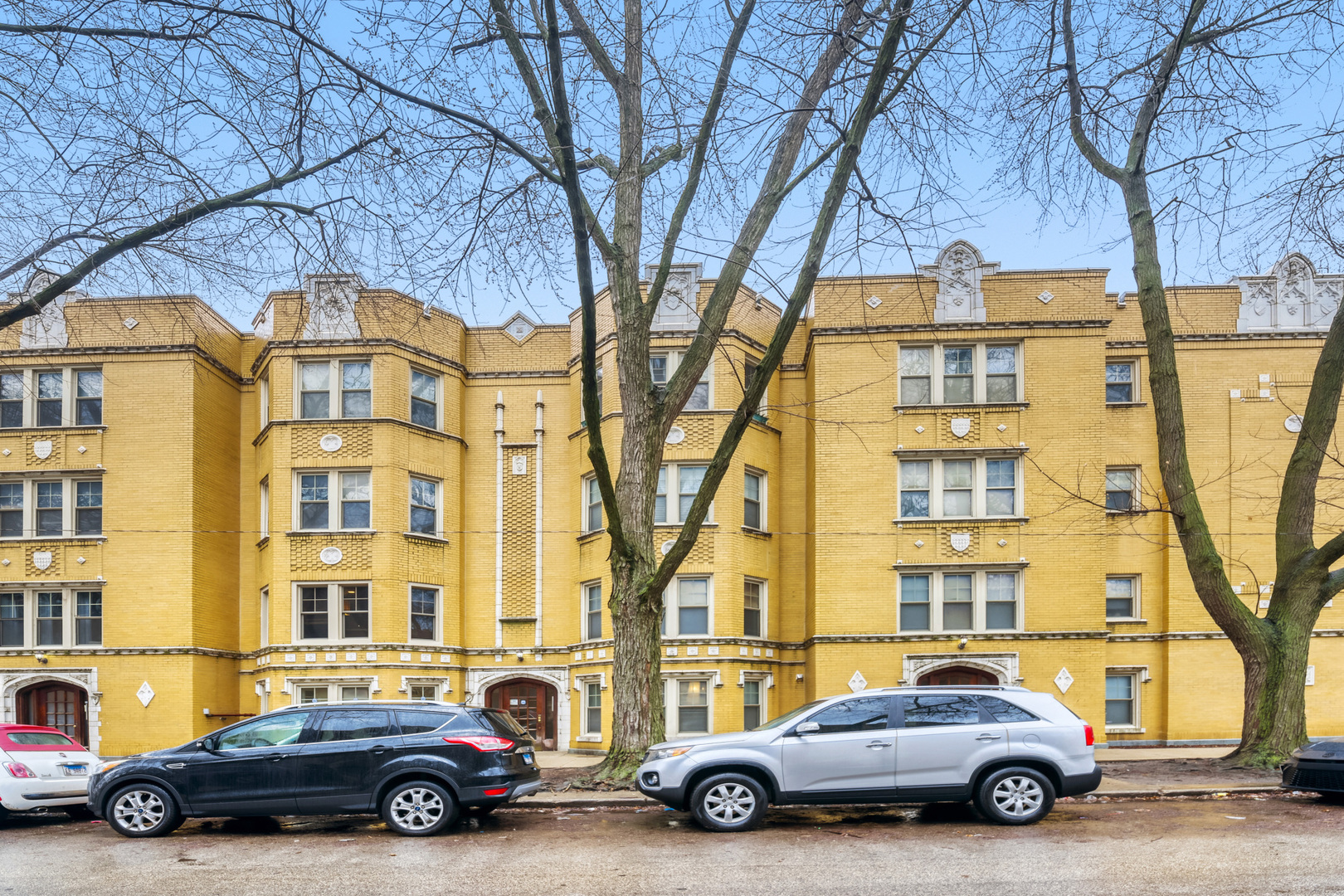 6450 North Bell Avenue, Unit G Chicago, IL 60645 - Photo 1 of 18 a car parked in front of a building