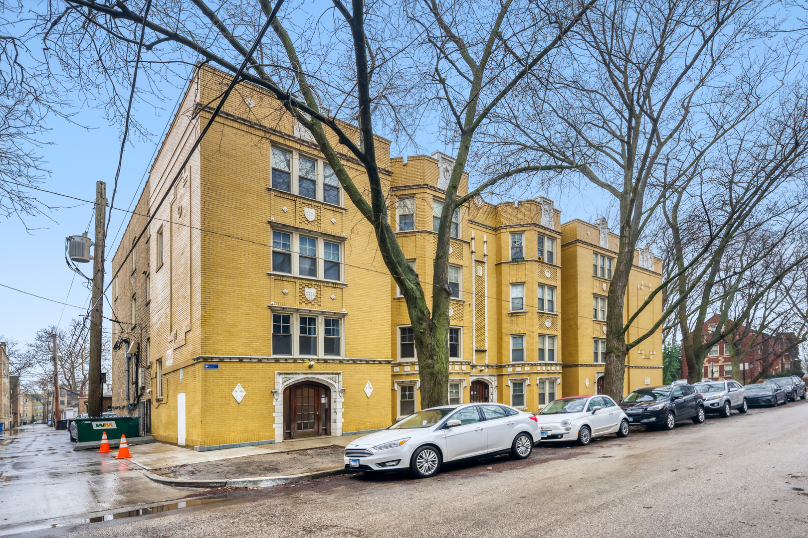 6450 North Bell Avenue, Unit G Chicago, IL 60645 - Photo 2 of 18 a front view of a building with parking space
