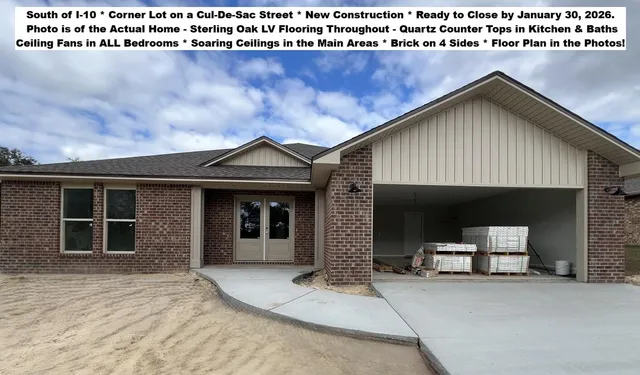 a view of a house with a wooden fence