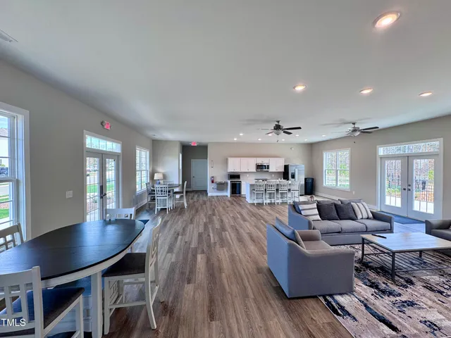 a view of a house with pool and chairs