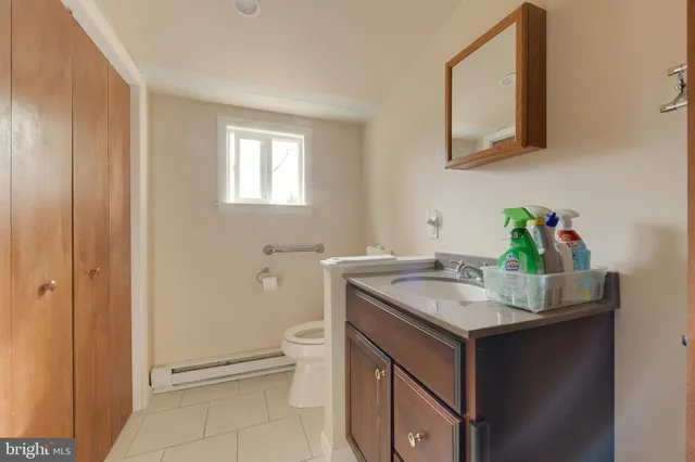a bathroom with a sink toilet and vanity
