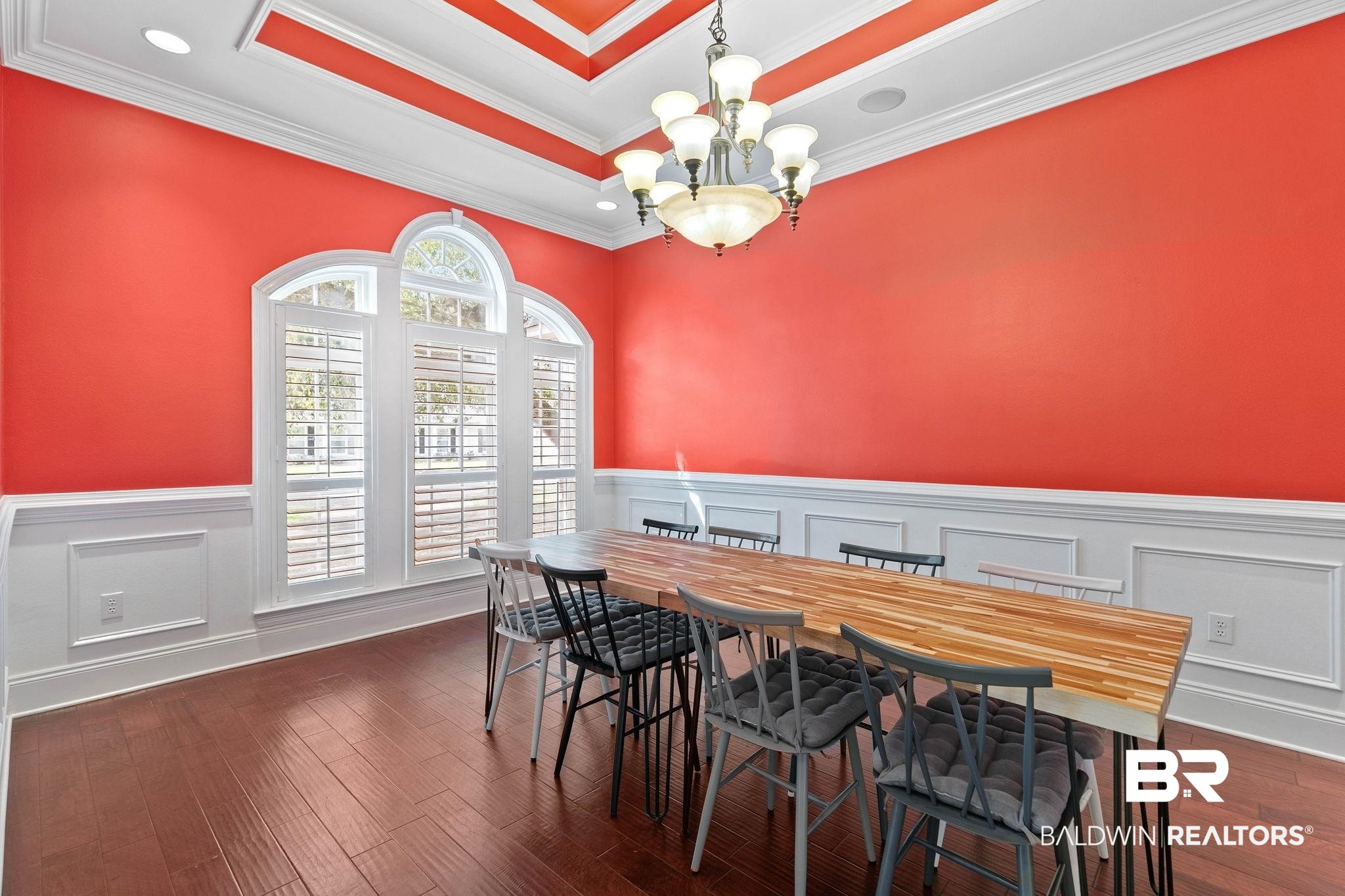 3668 Claridge Road North Mobile, AL 36608 - Photo 29 of 100 Dining space with a decorative wall, a wainscoted wall, hanging lights, ornamental molding, and dark wood-style floors