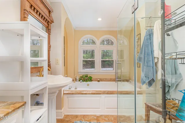 a view of an entryway with wooden floor and door
