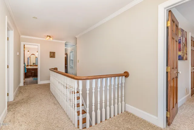a view of a hallway with a bathtub and a bathroom