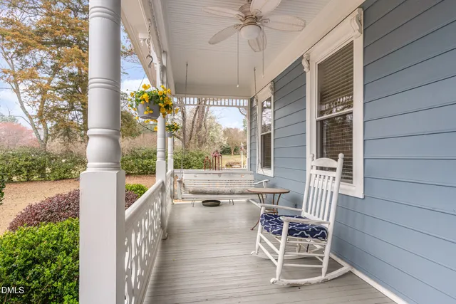 a view of balcony with a table and chairs