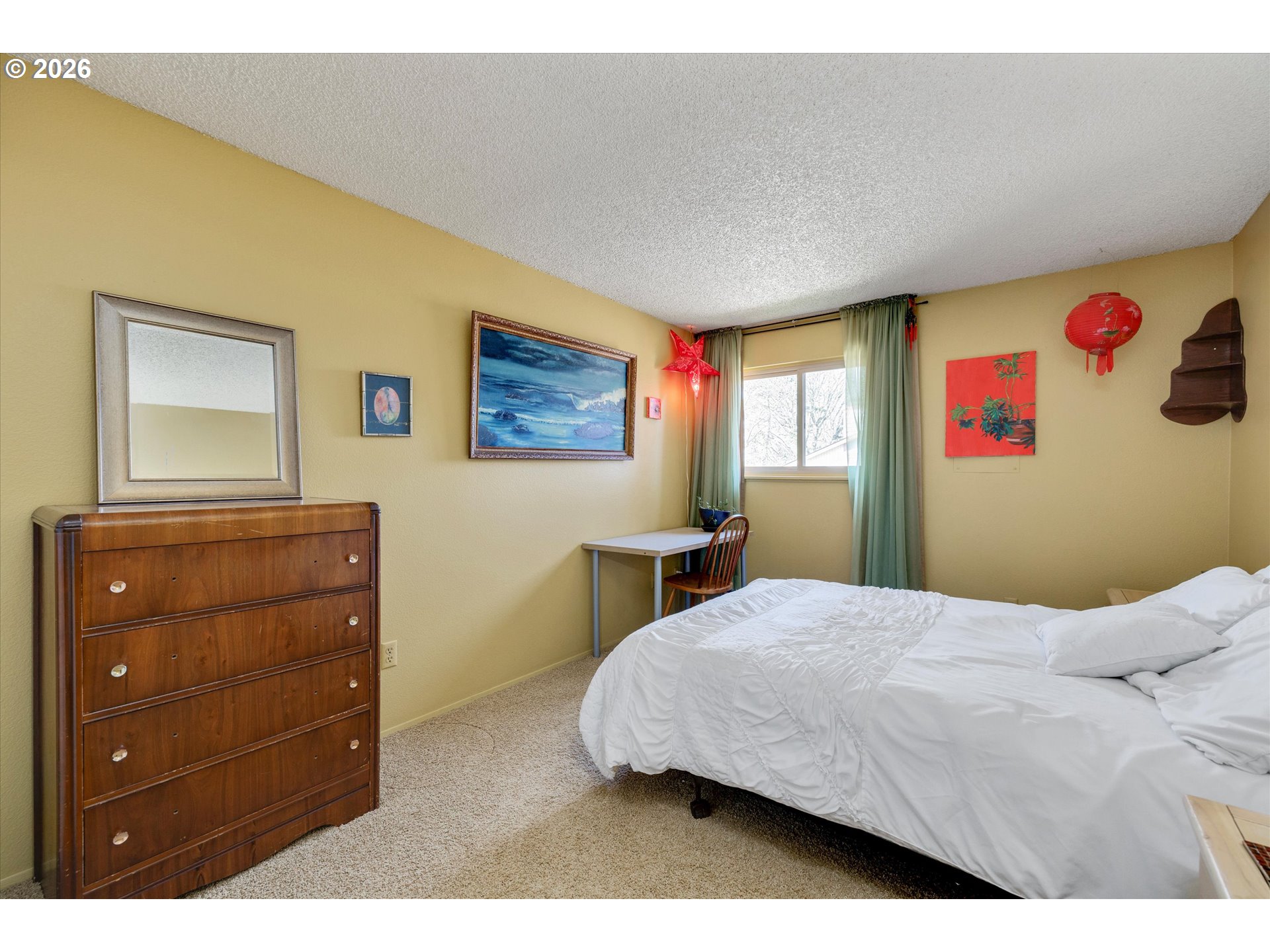 831 Northeast 90th Avenue Portland, OR 97220 - Photo 12 of 25 a bedroom with a bed and a dresser in it