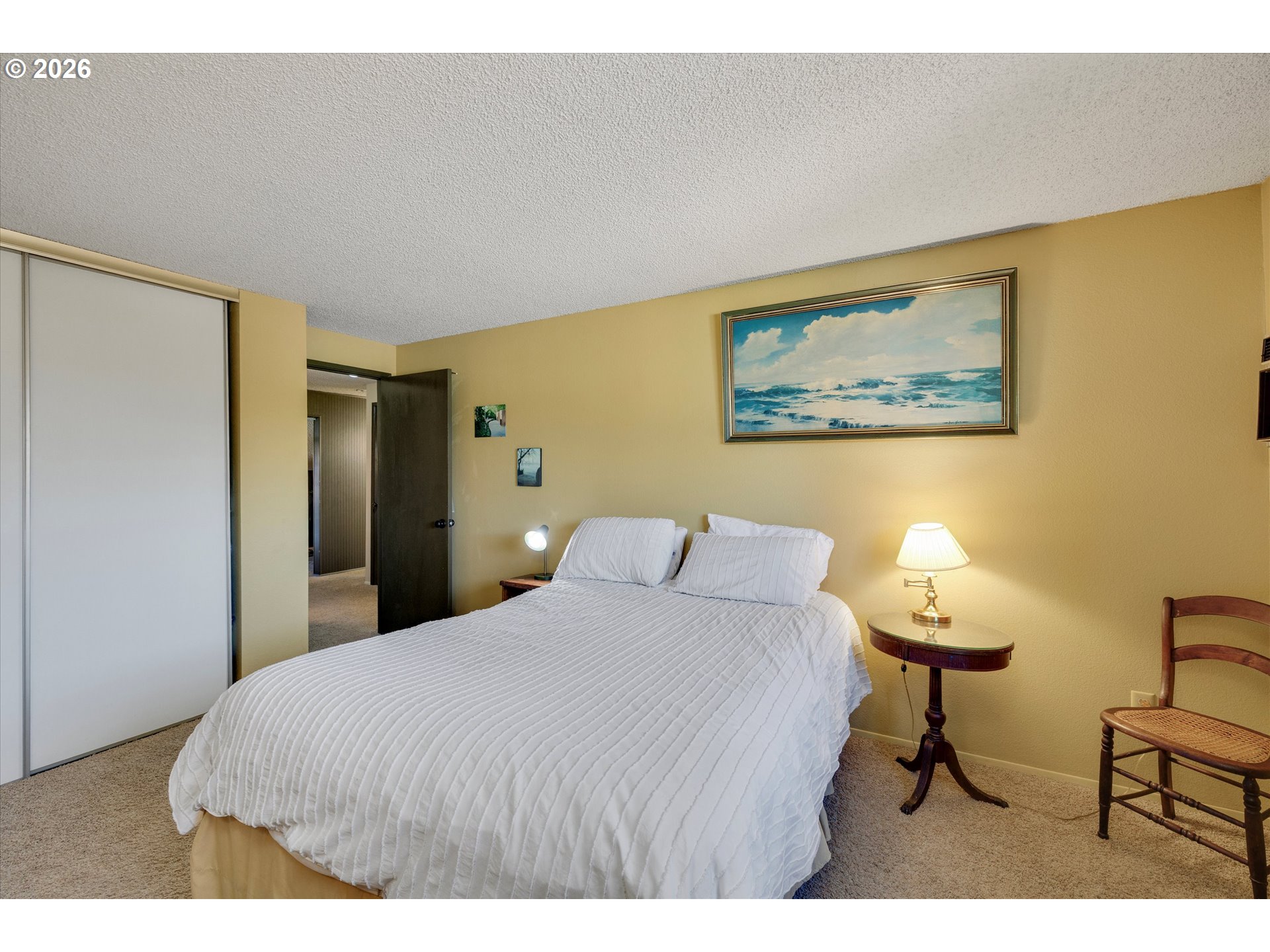 831 Northeast 90th Avenue Portland, OR 97220 - Photo 17 of 25 a bedroom with a bed and a painting on the wall