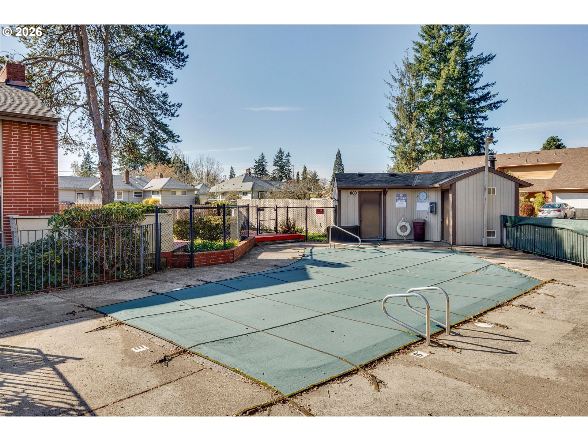 831 Northeast 90th Avenue Portland, OR 97220 - Photo 23 of 25 a view of a white house with a small yard and plants