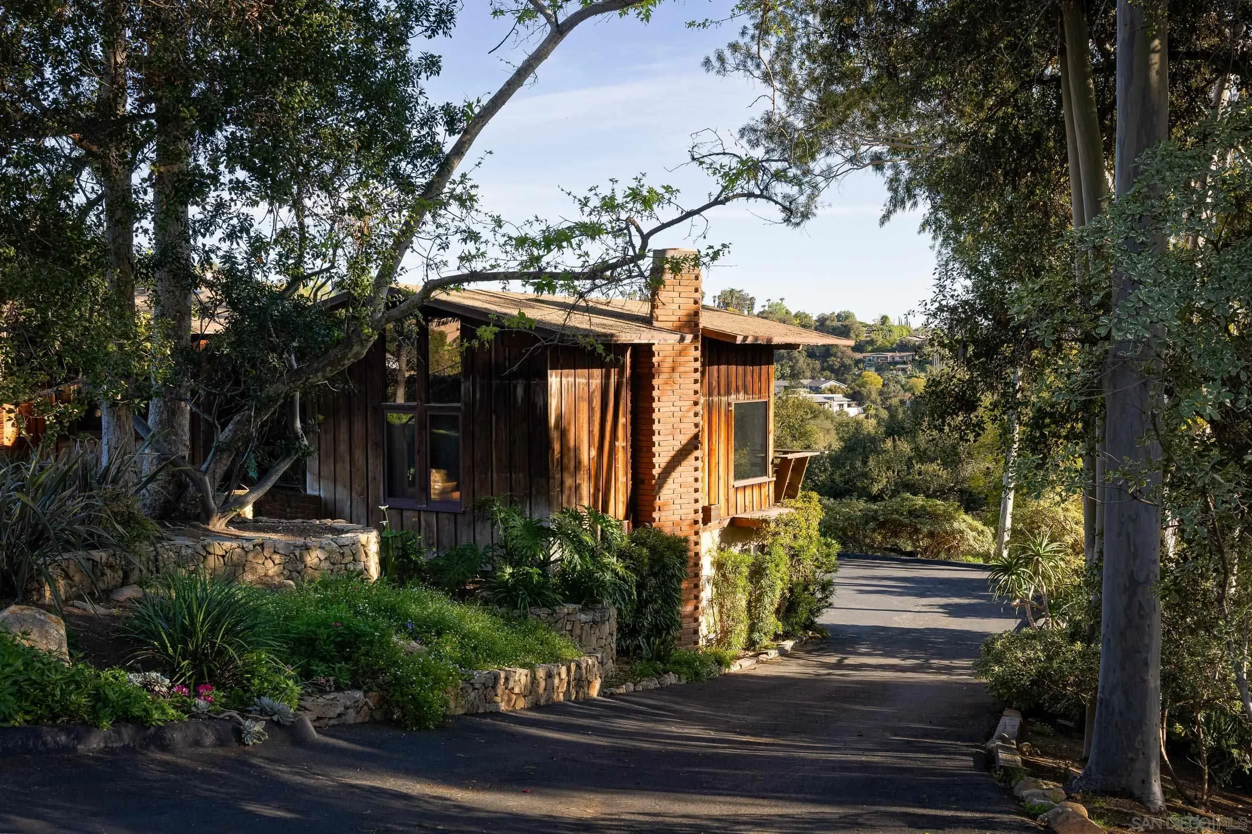 2411 Canyon Road Escondido, CA 92025 - Photo 2 of 41 a front view of a house with garden