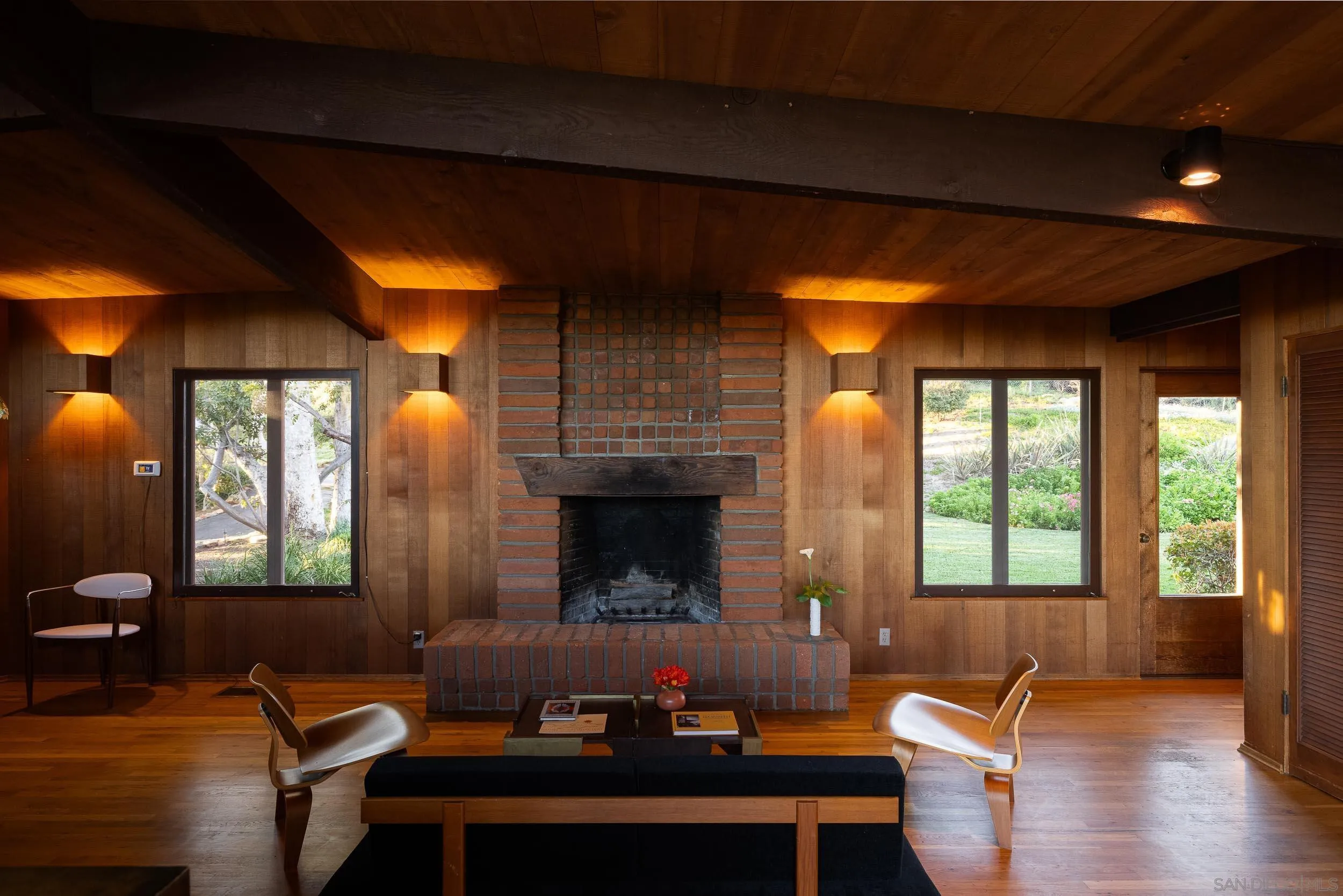 2411 Canyon Road Escondido, CA 92025 - Photo 24 of 41 a living room with furniture and a fireplace