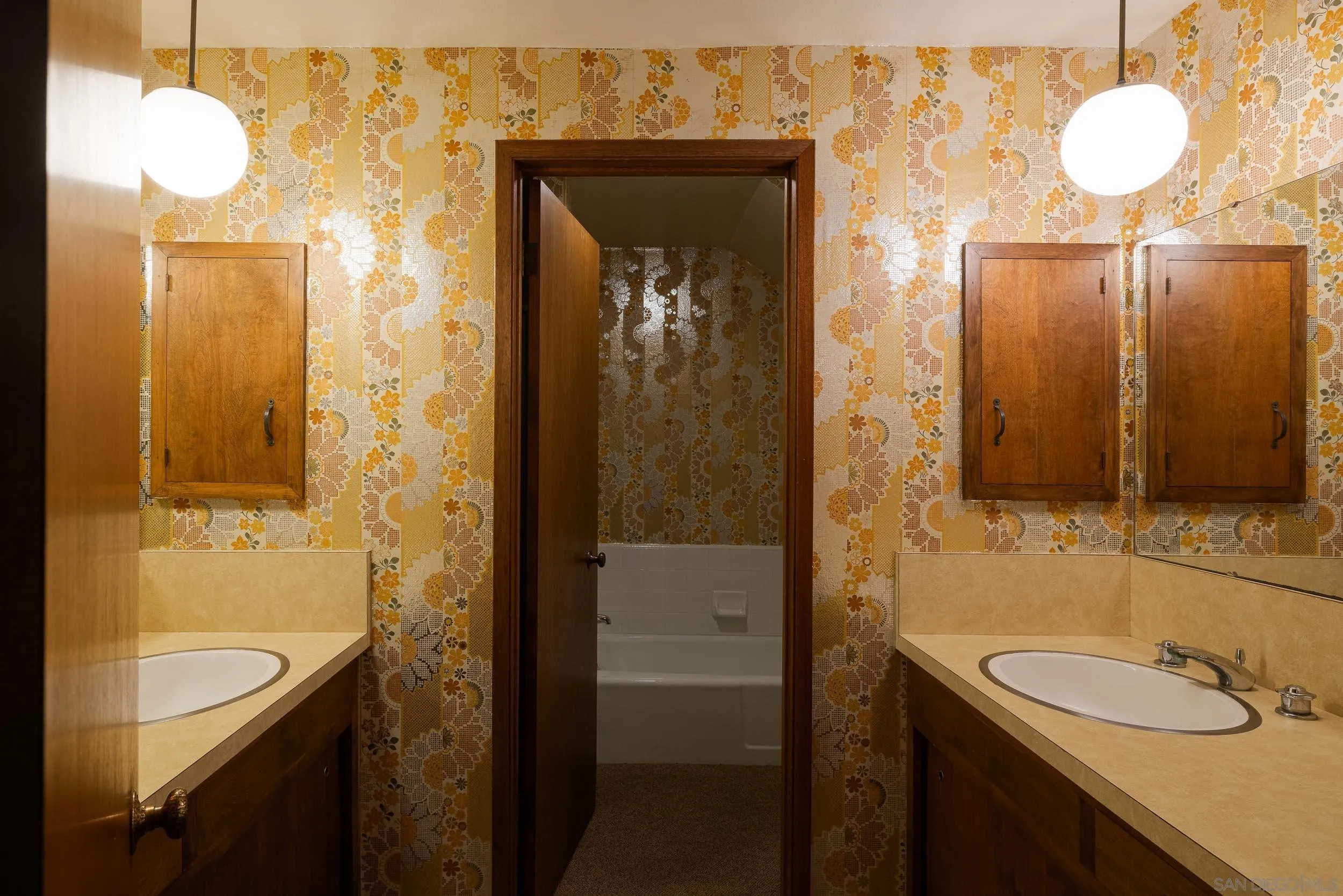 2411 Canyon Road Escondido, CA 92025 - Photo 29 of 41 a bathroom with a sink and a mirror