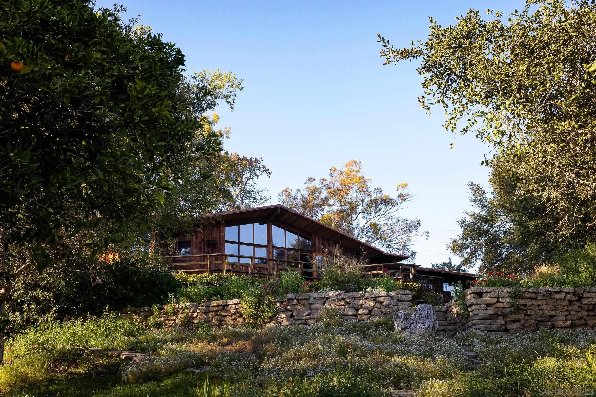 2411 Canyon Road Escondido, CA 92025 - Photo 30 of 41 a front view of a house with a yard