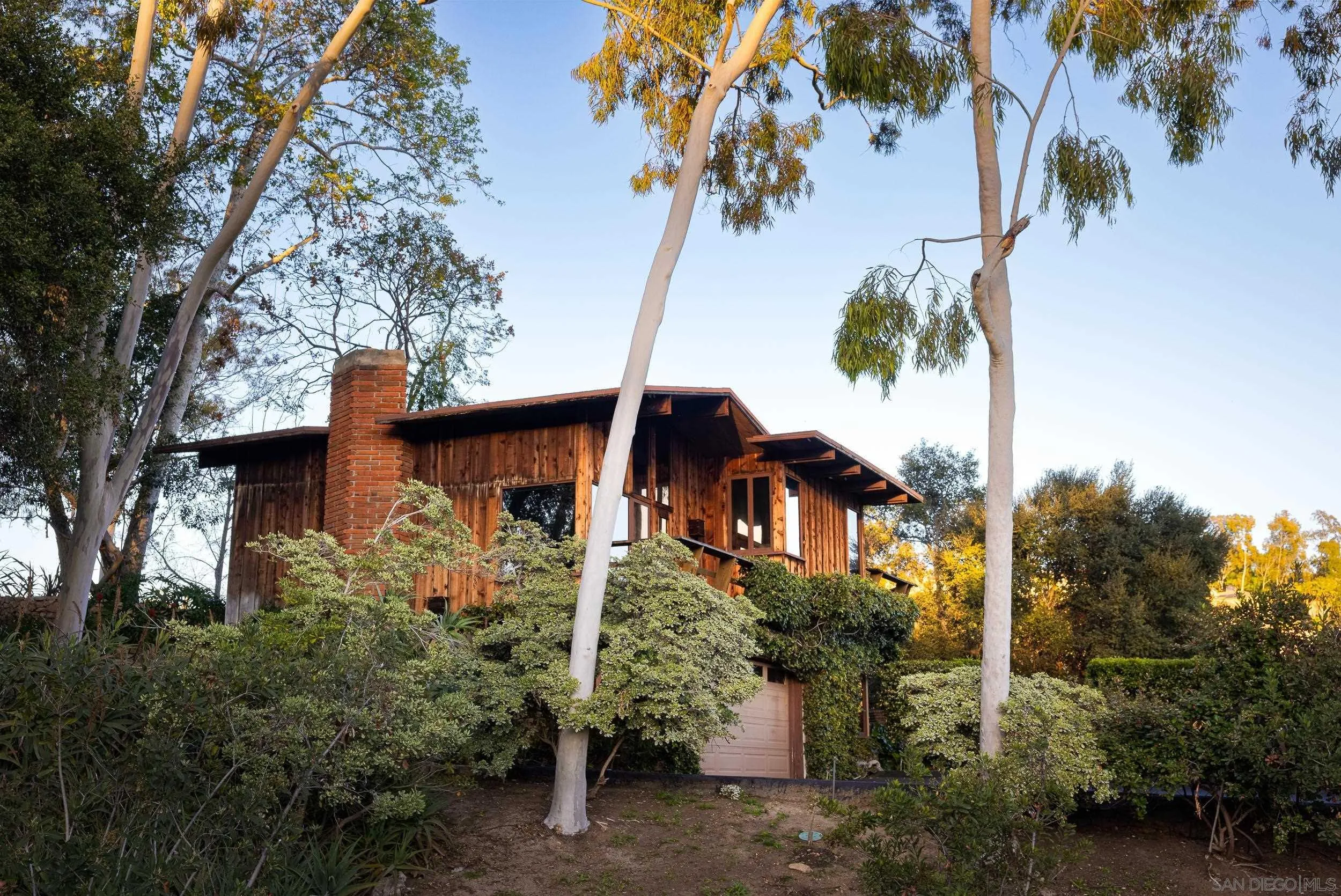 2411 Canyon Road Escondido, CA 92025 - Photo 5 of 41 a view of a house with a tree in the background