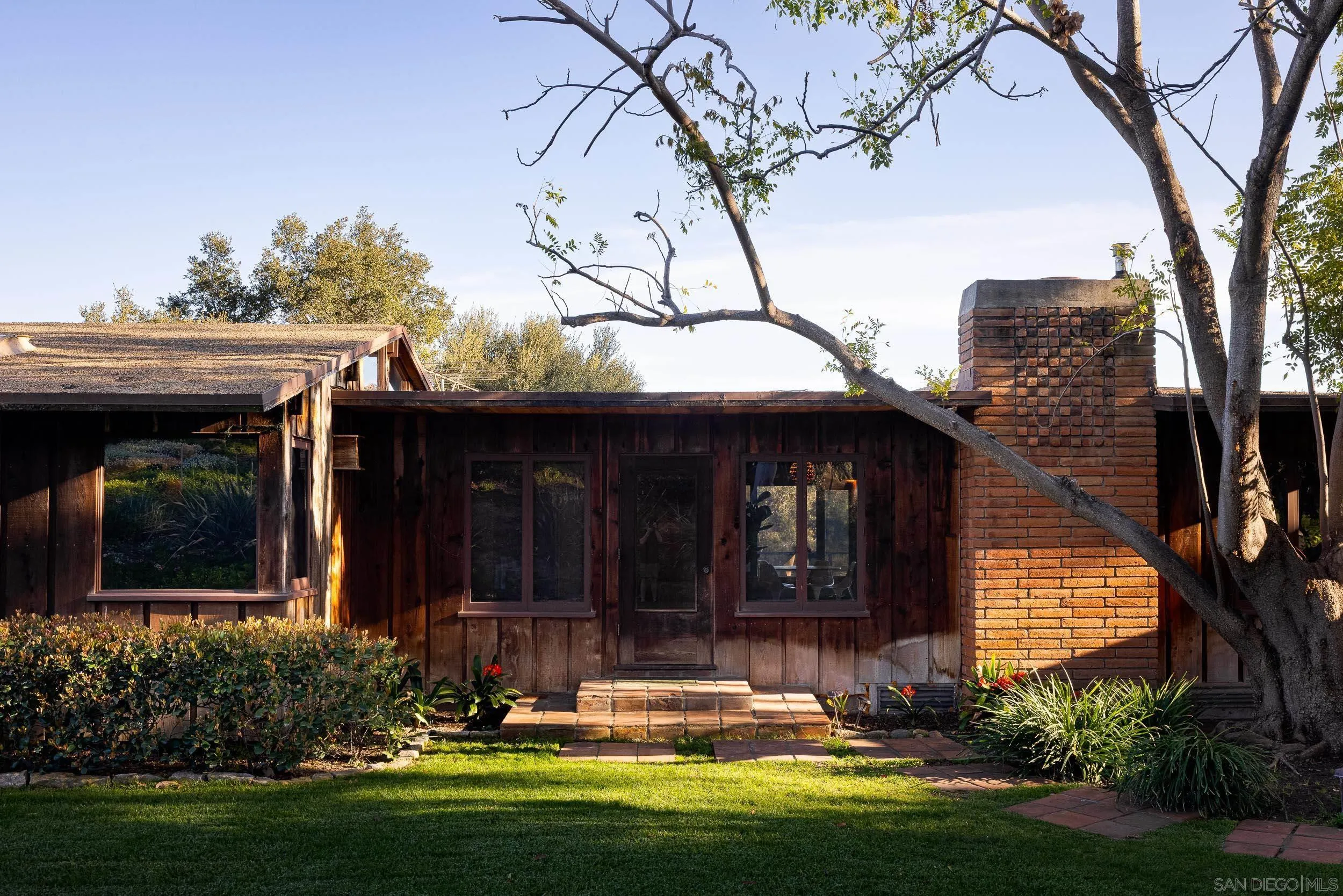 2411 Canyon Road Escondido, CA 92025 - Photo 7 of 41 a view of a house with backyard and trees