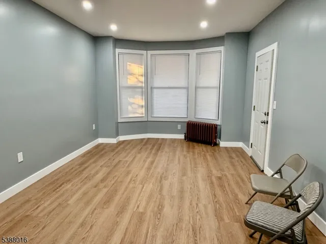 a bedroom with a bed and chair