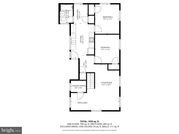 a picture of a bench in front of a wall