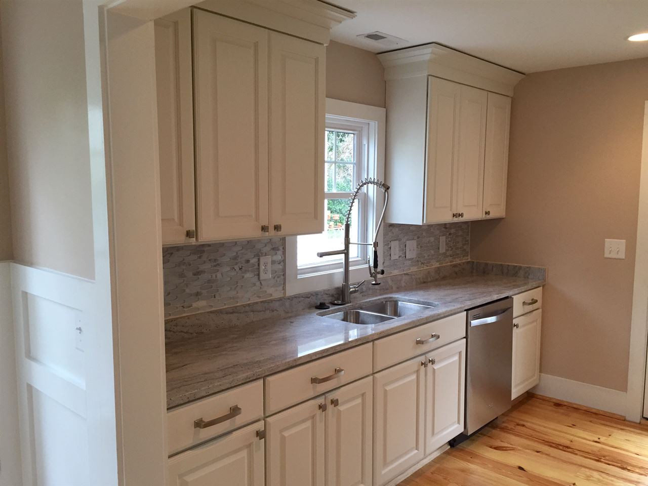 3132 Stanhope Avenue Raleigh, NC 27607 - Photo 3 of 11 Fabulous Kitchen With Custom Cabinets, Granite Counters, Stainless Appliances, Marble & Glass Backsplash and Hardwood Floors! Kitchen