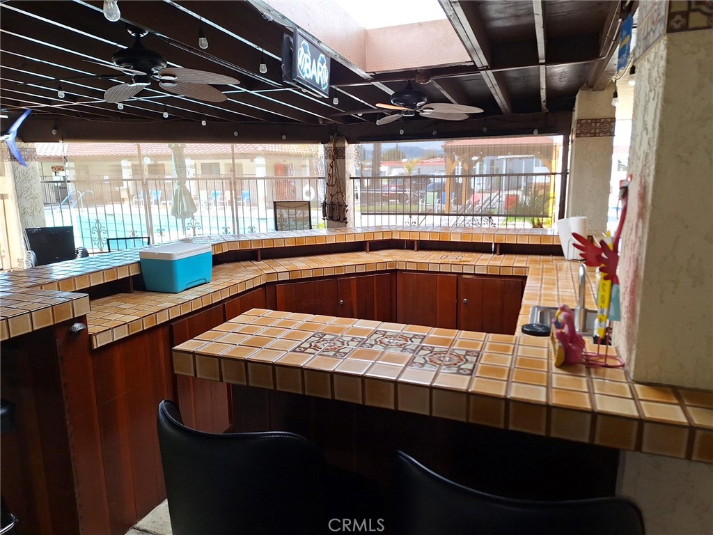 860 Birch Drive San Jacinto, CA 92583 - Photo 14 of 16 a kitchen with a table chairs and a sink