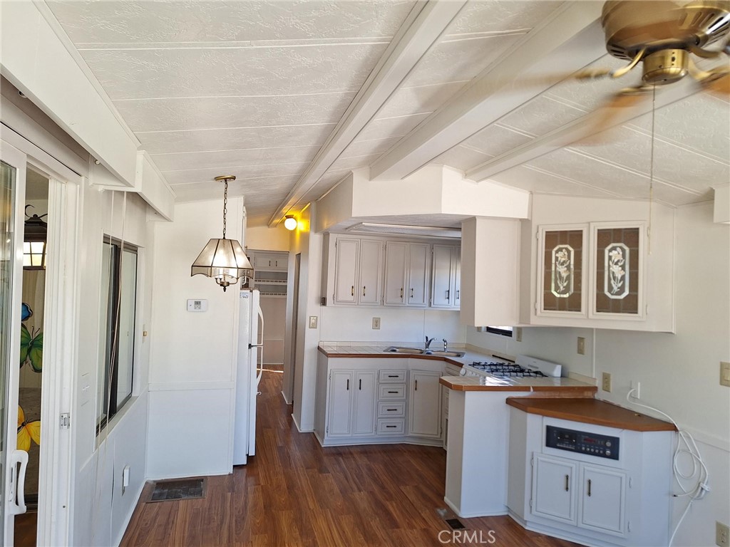 860 Birch Drive San Jacinto, CA 92583 - Photo 2 of 16 a bathroom with a granite countertop sink a mirror and shower