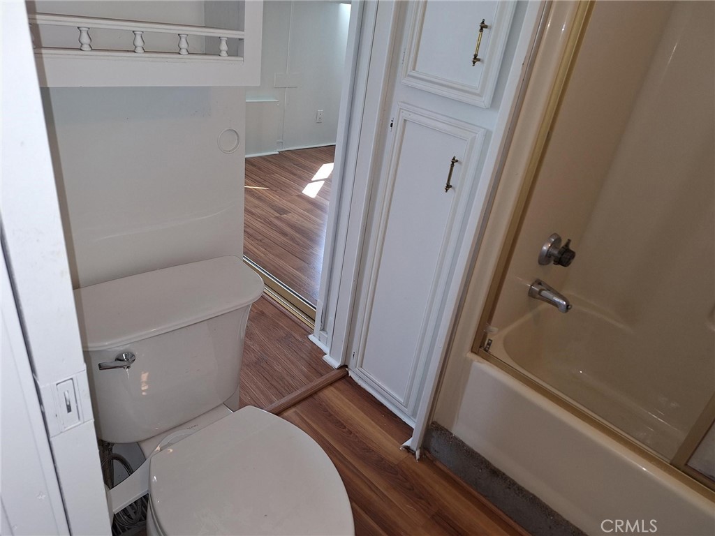 860 Birch Drive San Jacinto, CA 92583 - Photo 6 of 16 a white toilet sitting next to a sink