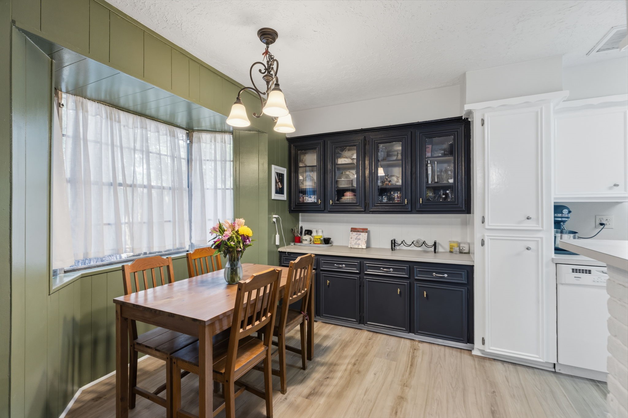 9618 Rannock Way Spring, TX 77379 - Photo 10 of 24 a kitchen with a sink a cabinets and chairs