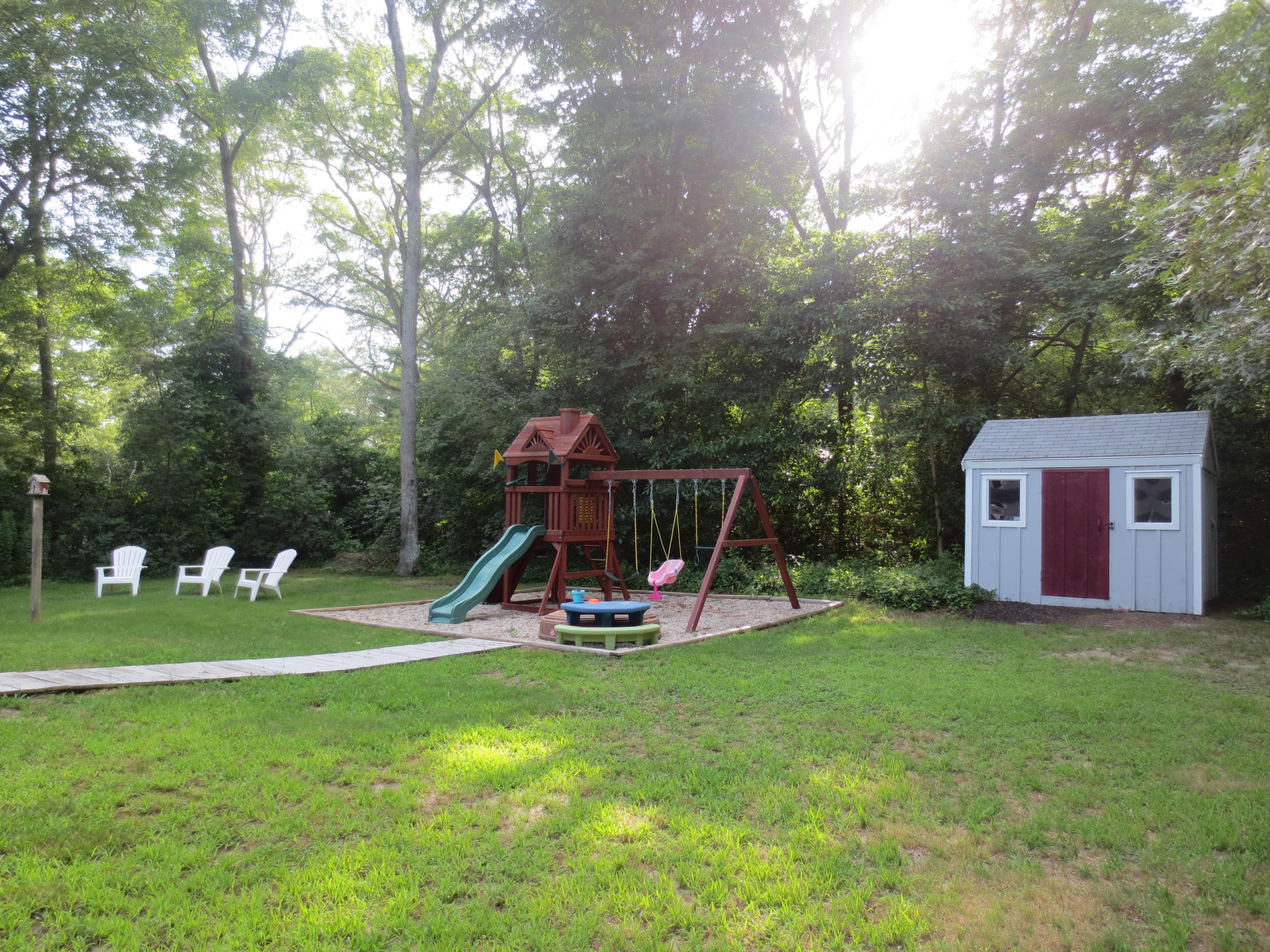 35 Stage Coach Road Centerville, MA 02632 - Photo 5 of 29 a view of a park with a slide