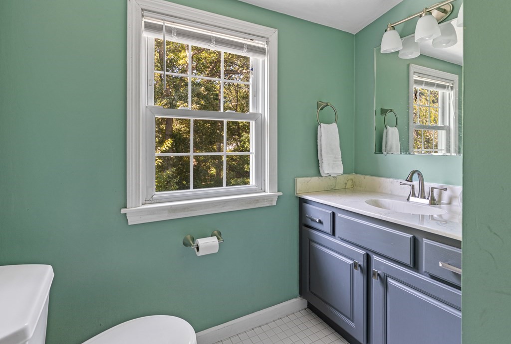 14 Hoover Road Northborough, MA 01532 - Photo 22 of 30 a bathroom with a sink a toilet and a mirror