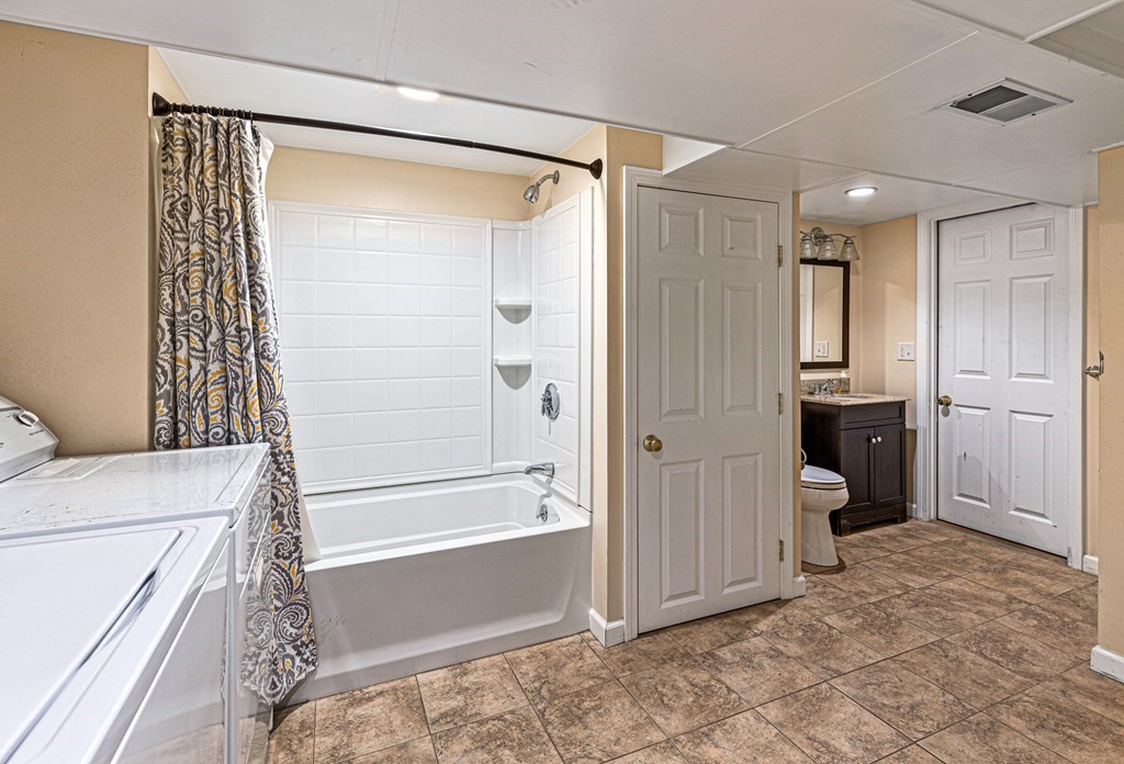 14 Hoover Road Northborough, MA 01532 - Photo 24 of 30 a bathroom with a bathtub and a shower