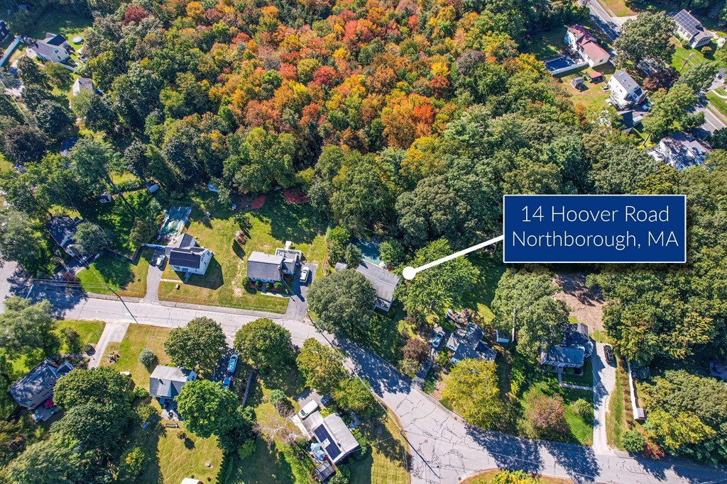 14 Hoover Road Northborough, MA 01532 - Photo 3 of 30 a sign that is sitting in front of flowers