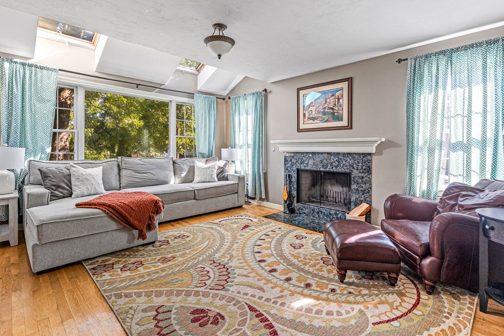 14 Hoover Road Northborough, MA 01532 - Photo 5 of 30 a living room with furniture large window and a fireplace