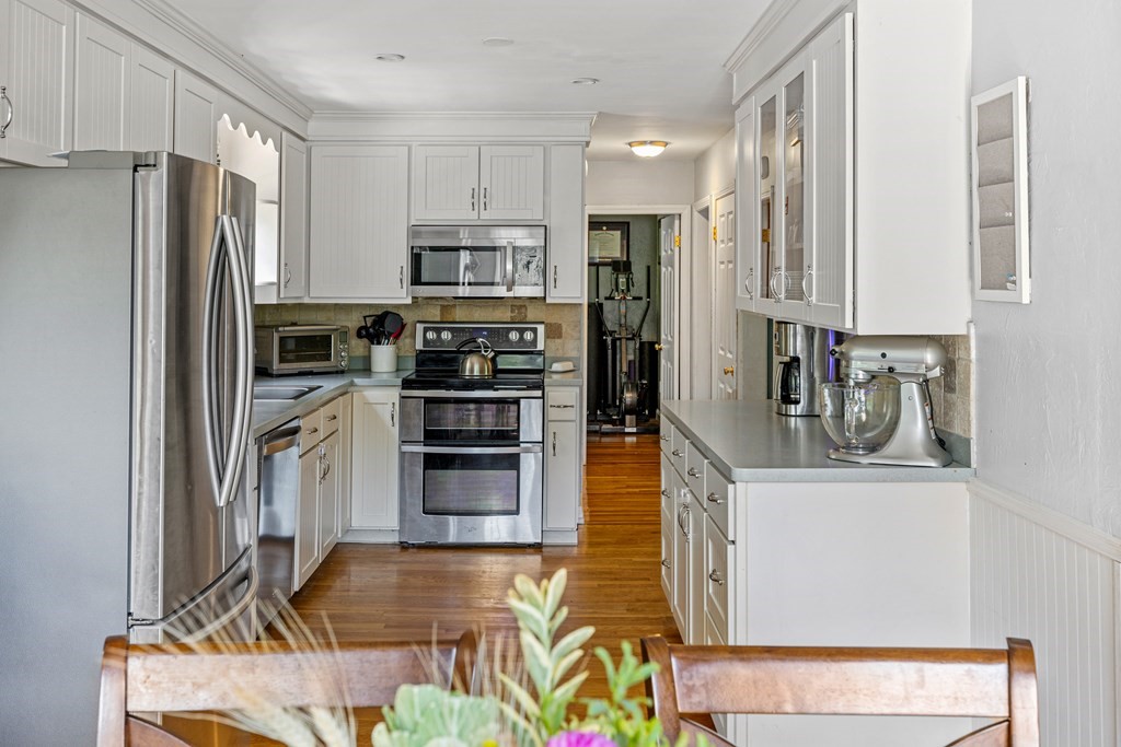 14 Hoover Road Northborough, MA 01532 - Photo 9 of 30 a kitchen with stainless steel appliances a refrigerator and a stove top oven