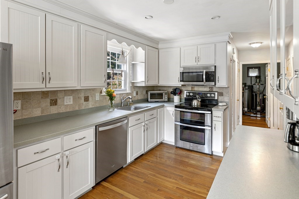 14 Hoover Road Northborough, MA 01532 - Photo 10 of 30 a kitchen with cabinets stainless steel appliances and a window