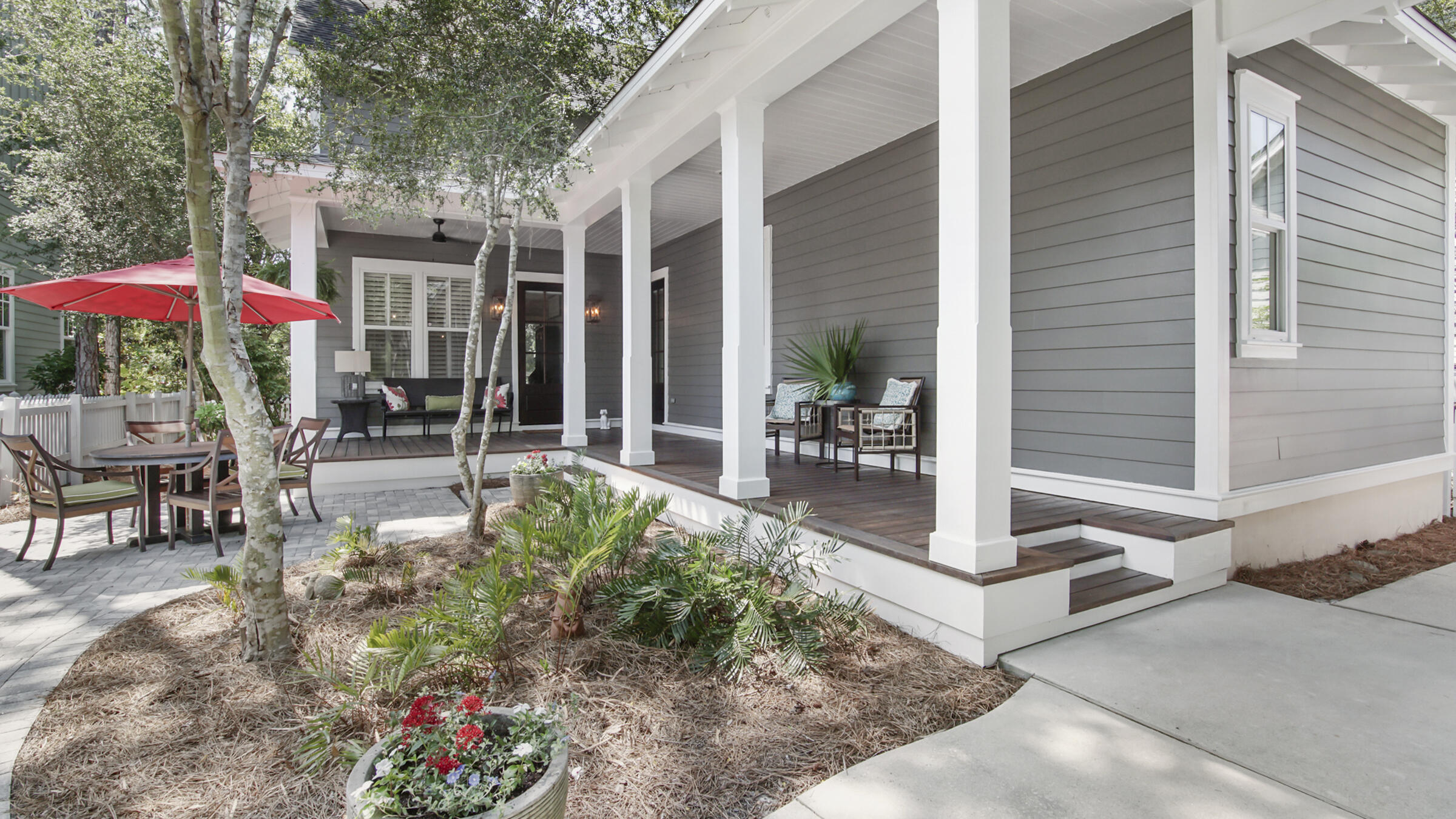 247 Artesian Way Watersound, FL 32461 - Photo 1 of 36 a view of a patio with table and chairs potted plants