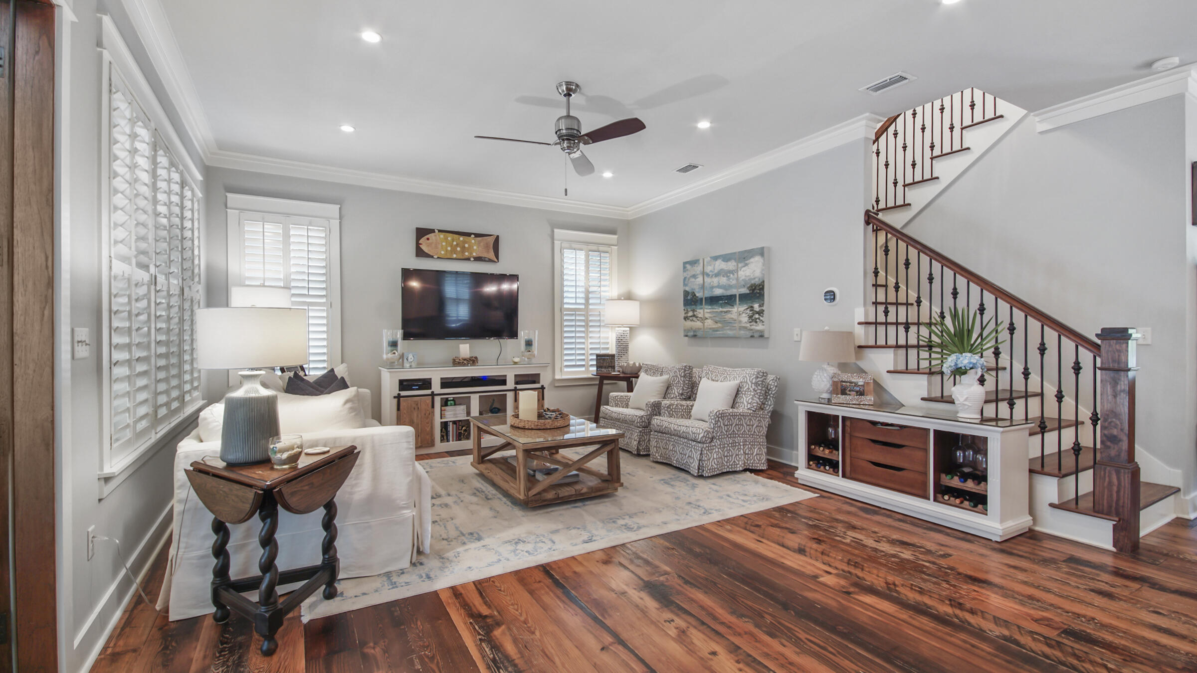 247 Artesian Way Watersound, FL 32461 - Photo 12 of 36 a living room with furniture a fireplace and a flat screen tv