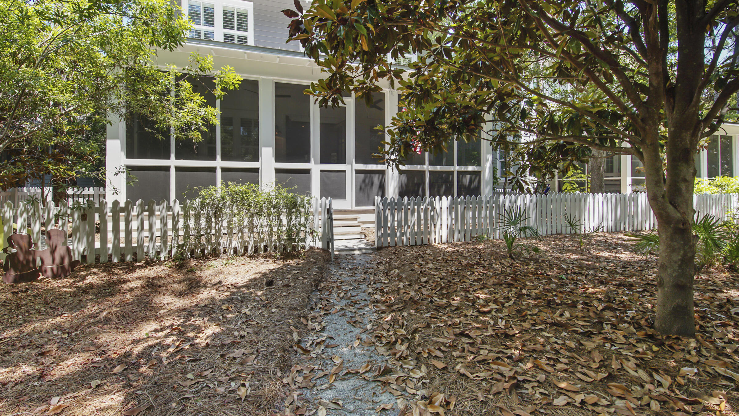 247 Artesian Way Watersound, FL 32461 - Photo 17 of 36 a view of a house with a small yard and wooden fence