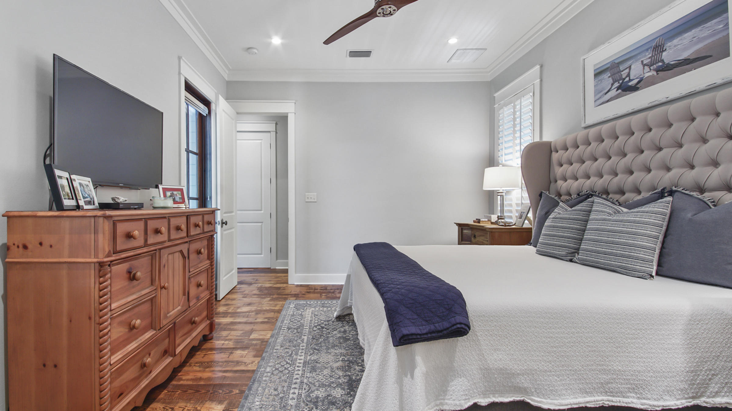 247 Artesian Way Watersound, FL 32461 - Photo 19 of 36 a bedroom with furniture and window