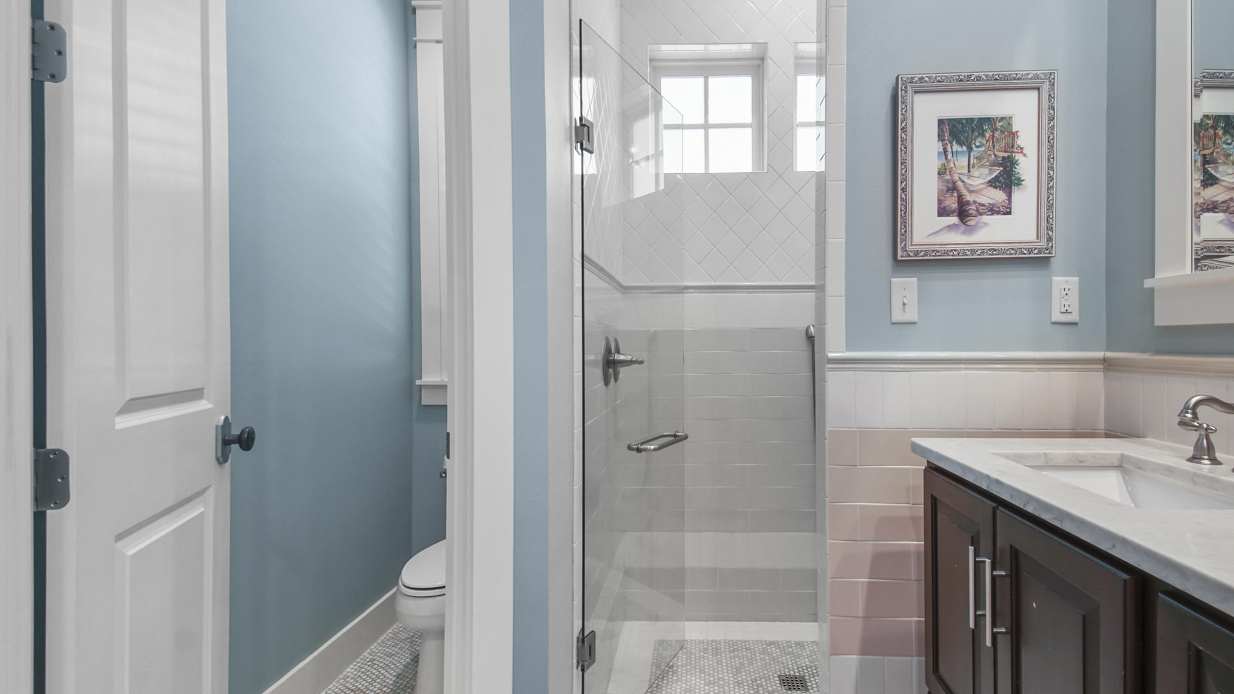 247 Artesian Way Watersound, FL 32461 - Photo 22 of 36 a bathroom with a sink mirror and a shower